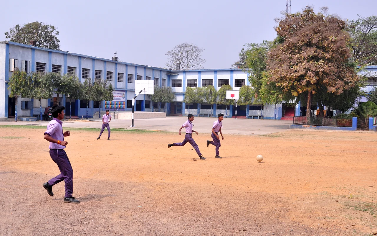 Students playing football at Don Bosco Ramkanali campus